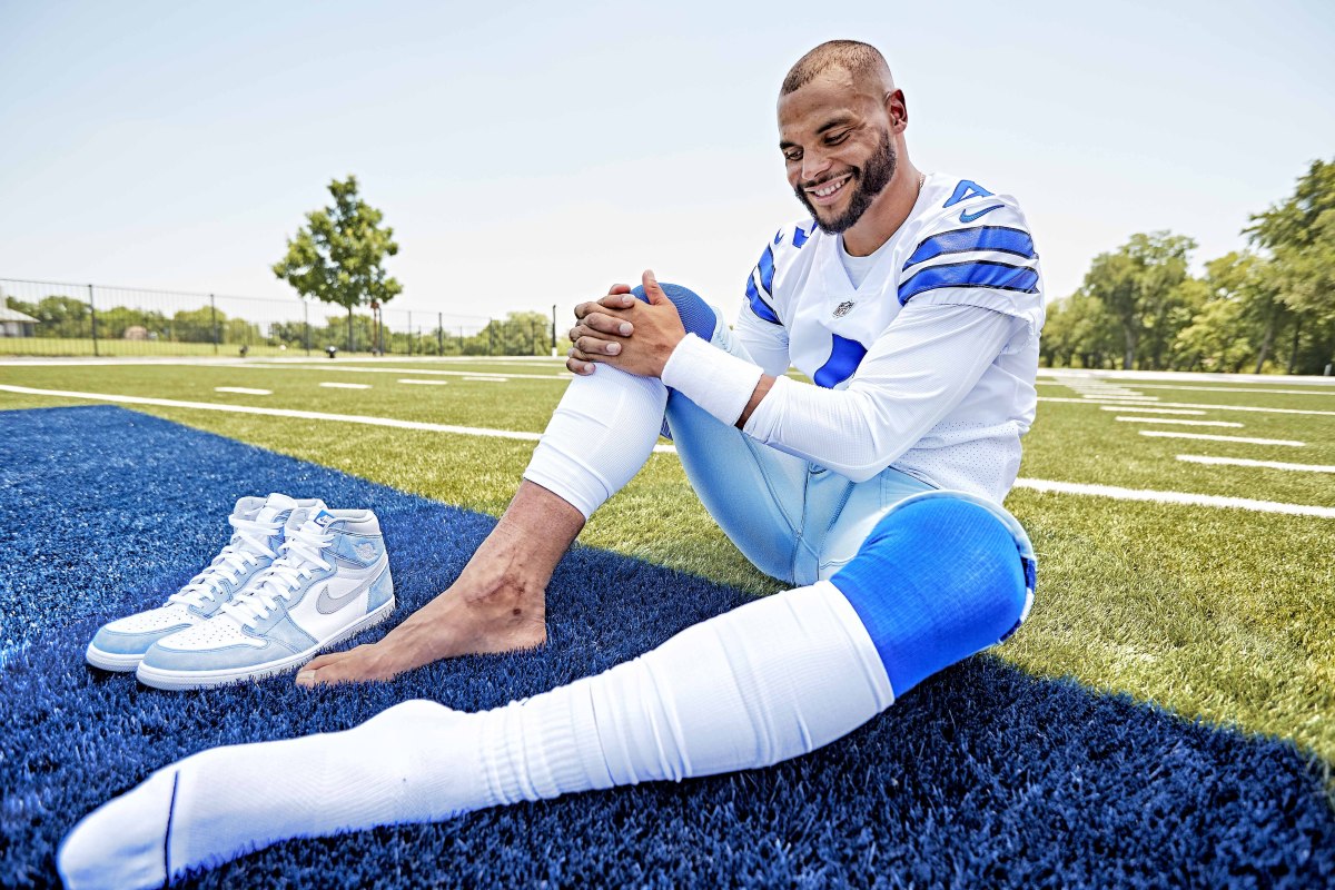 Dak Prescott poses for a photo, showing the scar on his right ankle
